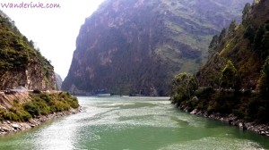 The emerald green waters of the Beas-Tirthan confluence